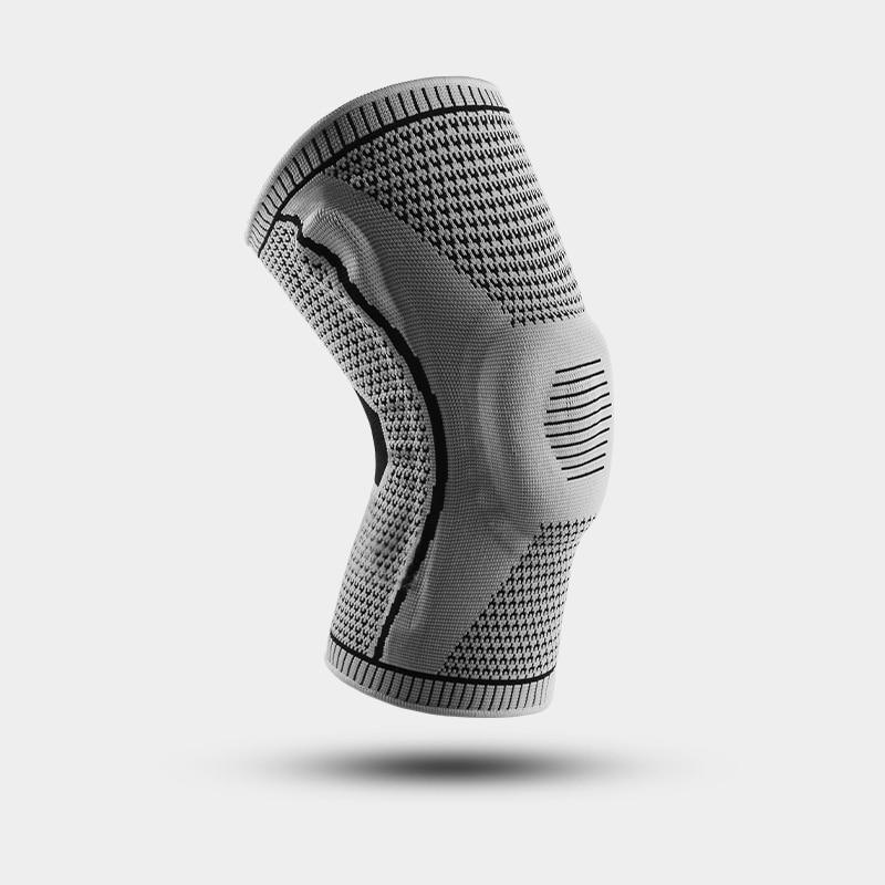 Knee sleeve shown alone in a side view with a contoured knit design and reinforced knee area.